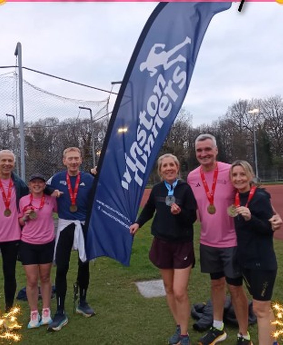 Winston Runners club members celebrating at the track